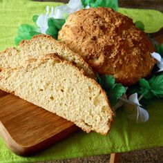 two loaves of bread sitting on top of a cutting board