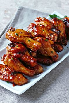 chicken wings with sauce on a white plate