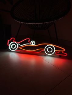 a lit up car sitting on top of a floor