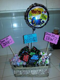 a basket filled with lots of candy on top of a counter