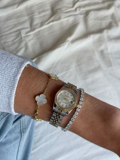 Indulge in timeless elegance with our exquisite watch and bracelet ensemble! Adorn your wrist with a stunning watch adorned with intricate details, perfectly paired with beaded diamond bracelets that sparkle with every movement. Elevate your style and make a statement with this captivating combination of luxury and sophistication. 💫 #TimelessElegance #BeadedDiamondBracelets #LuxuryWatches #leluxy Rolex Watch Bracelet Stack, Watches Women With Bracelets, Rolex Stack Bracelets, Rolex With Van Cleef, Womens Watches Aesthetic, Rolex Van Cleef Stack, Rolex And Tennis Bracelet, Cartier Bracelet Stack With Rolex Watch, Watch Accessories Bracelets