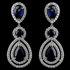 Sapphire%20Blue%20CZ%20Wedding%20Earrings%26nbsp%3B%0D%0AMake%20a%20glamorous%20statement%20at%20your%20wedding%20or%20formal%20occasion%20with%20these%20gorgeous%20earrings.%20These%20exquisite%20wedding%20earrings%20feature%20glistening%20cz%20crystals%20encircling%20round%20and%20teardrop%20sapphire%20crystals.%20These%20gorgeous%20rhodium%20plated%20earrings%20are%20the%20perfect%20accessory%20to%20complete%20your%20elegant%20bridal%20look.%0D%0AAlso%20a%20fabulous%20accessory%20for%20your%20quinceanera%20or%20pageant!Size%3A%202%201%2F4%22%20long%20and%207%2F8%22%20wide.%0D%0AColor%3A%20Silver%2FSapphire%20blue.%0D%0AStyle%3A%20E9803S.%0D%0APlease%20allow%201%20week%20for%20delivery.%0D%0AShipping%20Policy.%0D%0AReturn%20Policy Royalty Jewelry, October Birthstone Jewelry, Necklace Outfit, Dangle Earrings Wedding, Ruby Rings, Prom Accessories, Jewelry Showcase, Prom Earrings, Bridal Fashion Jewelry