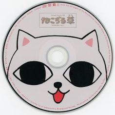 a white cat with black eyes and red tongue on a cd disc cover that has the words hello kitty written in japanese