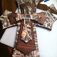 the cross is made out of realtree camo paper and has been cut into smaller pieces