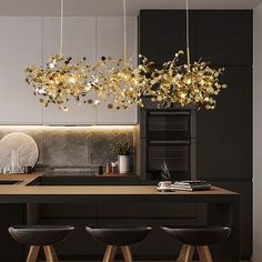 the lights are hanging over the kitchen island in this modern style kitchen with black cabinets and stools