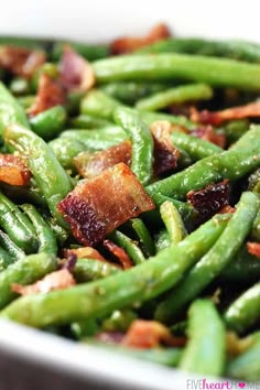 green beans with bacon in a white bowl