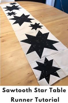 a table runner with stars on it and the words, sawtooth star table runner