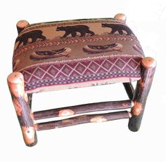 an upholstered wooden stool with bears on it