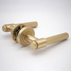 two golden handles on a white background