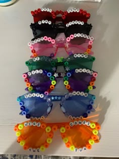 several pairs of colorful sunglasses are on display