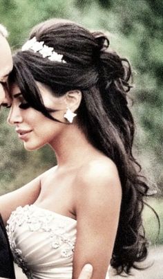 a bride and groom standing next to each other