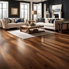 a living room filled with furniture and wooden flooring next to large windows on top of a hard wood floor