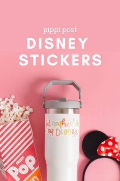 the disney stickers are next to a minnie mouse ears headband and some popcorn