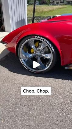 a red sports car parked in front of a garage with the words chop shop on it