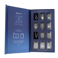 the twelve days of joy book is opened to show jewelry in it's box