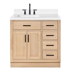 a white sink sitting under a wooden cabinet