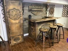 an image of a bar set up in the middle of a room with stools