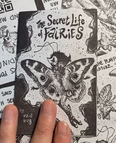 someone is holding up some black and white stickers on their back side, with the words'the secret life of faeries'written across them