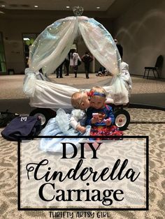 two babies sitting on top of a bed with the words diy cinderella carriage in front of them