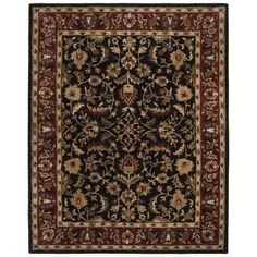 a black and red rug with an ornate design