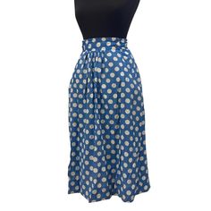 Beautiful Blue Polka Dot Skirt with pockets. below the Knee length for a romantic silhouette.  No lining. perfect color of spring! Size: Length: 74 cm Waist: 37 cm Fits Small/medium Your order will be shipped within 2 business days via FEDEX and you will typically receive your purchase within 4 days from date of shipping. Please note that vintage clothing sizes can vary greatly. I take measurements of by laying the garment flat. When considering whether a garment would fit, I suggest taking a si Retro Knee-length Skirt For Summer, Retro Blue Flared Skirt Bottoms, Vintage Midi Skirt With Pockets, Retro Long Blue Skirt, Vintage Blue Flared Skirt, Relaxed Knee-length Polka Dot Skirt, Retro Blue Pleated Skirt, Vintage Blue Full Skirt, Vintage Gathered Midi Skirt