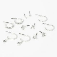 Switch up your jewelry look with a mix of silver-tone earrings! This set includes a mix of stud and hoop earrings, featuring geometric designs embellished with sparkly faux crystals. Finish: Silver-tone Closure: Post back Pack Size: 6 Material: Metal - Claire's Silver Embellished Geometric Stud & Hoop Earrings - 6 Pack Gender: female.  Age Group: kids. Emoji Jewelry, Teen Earrings, Geometric Studs, Silver Jewelry Earrings, Packing Jewelry, Fashionable Jewelry, Geometric Earrings, Adjustable Bracelet, 6 Pack