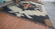 an old rug is sitting on the floor