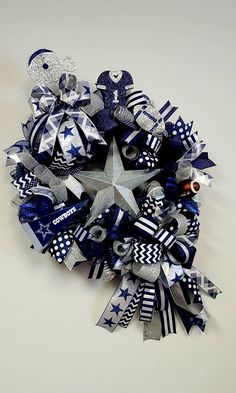 a blue and white wreath with silver stars