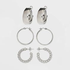 Three pairs of hoop earrings from Wild Fable™ are great for accenting everyday outfits. Varying designs include a simple hoop, textured and linked chain earrings for a different look each day. Made with silver-tone metal, the pieces are designed with clip-in clasp and postback closures for a secure fit. If you're not satisfied with any Target Owned Brand item, return it within one year with a receipt for an exchange or a refund. Wild Fable™: A look for every story. Nickel-free Edgy Hoop Jewelry, Affordable Nickel-free Punk Hoop Earrings, Cheap Tarnish-resistant Stainless Steel Hoop Earrings, Punk Sterling Silver Nickel-free Hoop Earrings, Hoop Earring Set, Nickel-free Silver Alloy Hoop Earrings, Chunky Hoop Earrings, Hoop Earring Sets, Wild Fable