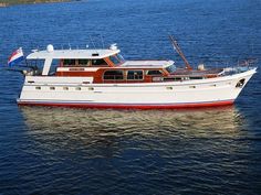 a red and white boat in the water