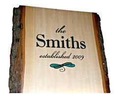 a sign for the smith established in 2009 on a tree trunk that has been cut down