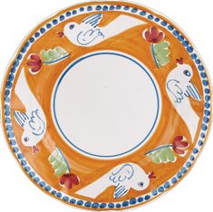 an orange and blue plate with birds on it's rim, in the shape of a circle