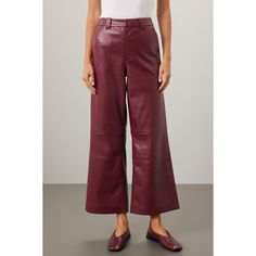 Red faux leather (100% Polyurethane faux leather). Pants. Front zipper closure. 28" inseam. 11.5" rise. Imported. Faux Leather Wide-leg Pants For Fall, Fall Wide-leg Faux Leather Pants, Leather Pants With Zipper Closure For Fall, Faux Leather Pants With Zipper Closure For Work, Red Leather Bottoms For Work, Leather Bottoms With Zipper Closure For Spring, Chic Red Leather Bottoms, Chic Leather Pants With Zipper Closure, Fall Faux Leather Pants With Zipper Closure