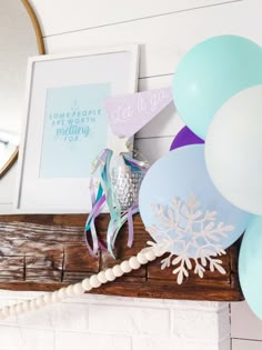 balloons, streamers and other decorations are on the mantle