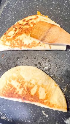 two tortillas are being cooked in a skillet