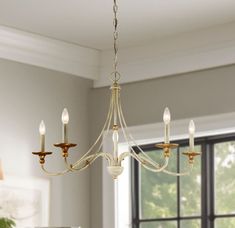 Upscale finishes and delicately styled frames combined with classically styled detailing offer an unmatched value. The Westchester County chandelier in farmhouse white with gilded gold leaf finish by Minka Lavery provides abundant light to your home, while adding style and interest. With classic proportions and clear bulbs accents. This collection offers transitional style in a beautiful profile. Minka Lavery Westchester County 5-Light Multiple Finishes White Traditional Chandelier | 1044-701 Chandelier Silver, Chandelier White, Wheel Chandelier, House White, Door Hardware Interior, Wagon Wheel Chandelier, White Chandelier, Candle Style Chandelier, Westchester County