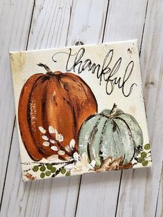 a painted sign with two pumpkins and the words, thank you all on it