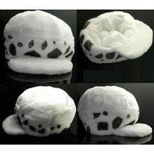 four different pictures of the same white hat with black spots on it, and one has two