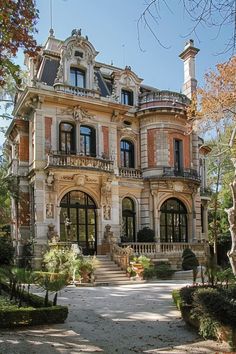 a large house with many windows and balconies