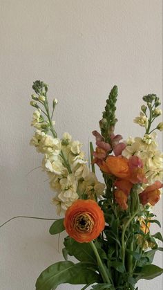 a vase filled with flowers on top of a table