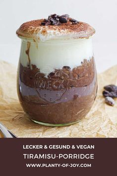 there is a dessert in a glass with chocolate and cream on top, along with the words lecker & geund & vegan tiramis - porridge