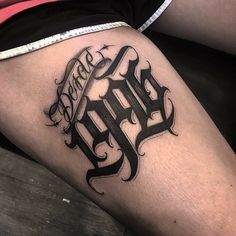 a person with a tattoo on their thigh