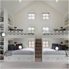 two bunk beds in a room with white walls