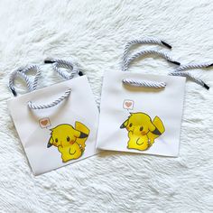 two small bags with cartoon characters on them