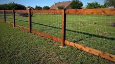 the fence is made of wood and wire