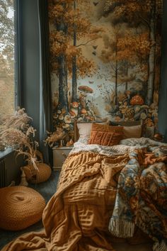 a bedroom with a large tapestry on the wall next to a bed and pillows in front of a window