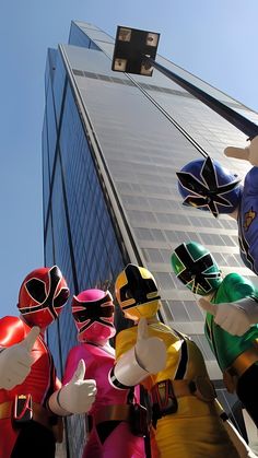 the power rangers are lined up in front of an office building