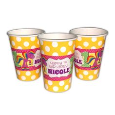 three yellow cups with white polka dots and an image of a unicorn on the side