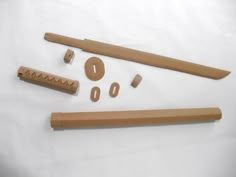 an assortment of wooden objects on a white surface