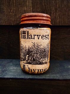 a jar that is sitting on top of a wooden shelf with the words harvest in it